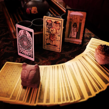 A deck of tarot cards spread out into an arc.